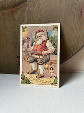 Load image into Gallery viewer, Antique Toy Shop Santa Postcard
